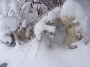 Mary, Joseph, and Baby Jesus covered in snow.