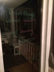 Use Window Markers or dry erase markers to write on windows.